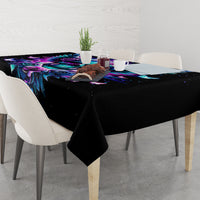 Black tablecloth featuring skull, wings, roses, and stars across the surface