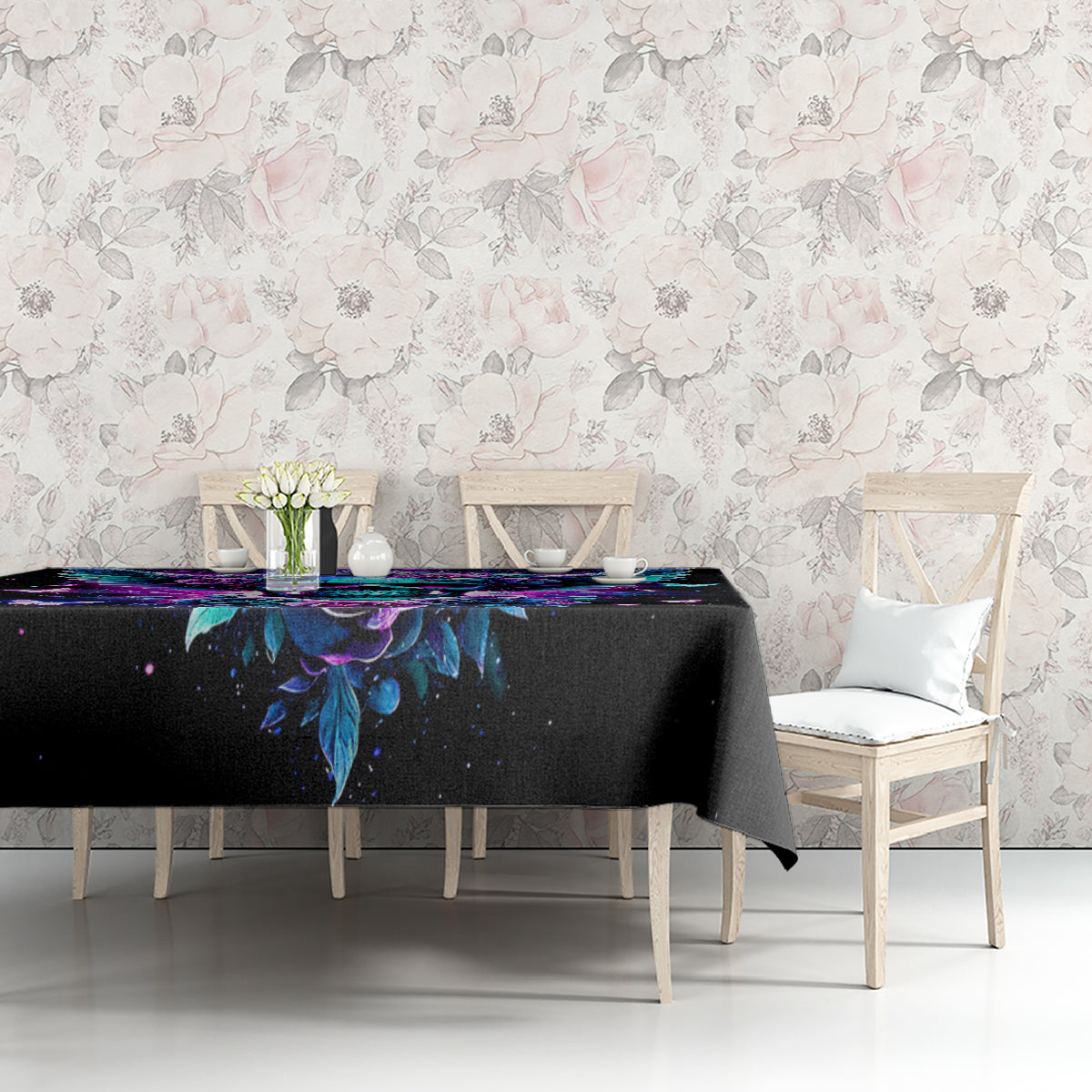 Black skull-and-wings tablecloth with colorful purple/blue artwork on tabletop