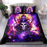 Skull fantasy bedding set on bed: black and purple duvet cover with two matching pillowcases
