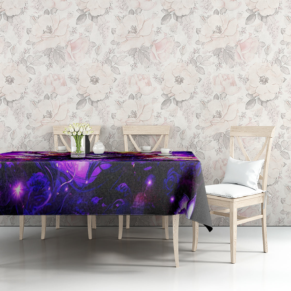 Black tablecloth with purple mystical artwork, dining table against floral wall