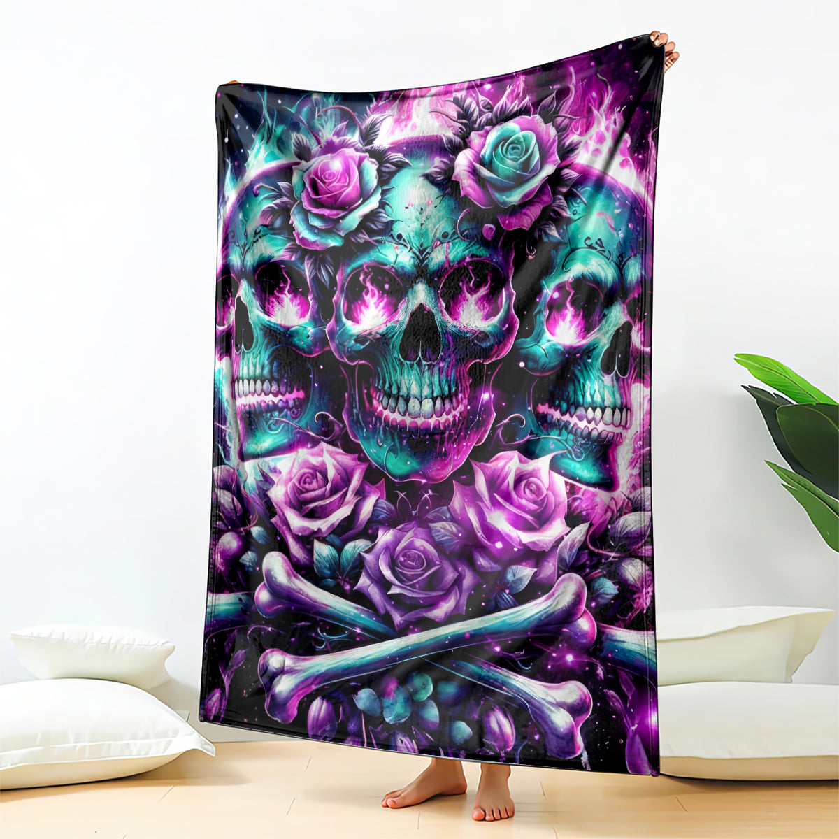 Purple skull and rose blanket with teal accents, folded and standing upright