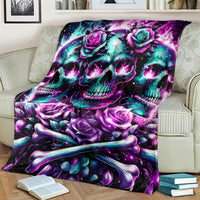 Skull with roses fleece blanket in purple and teal, draped on cream sofa