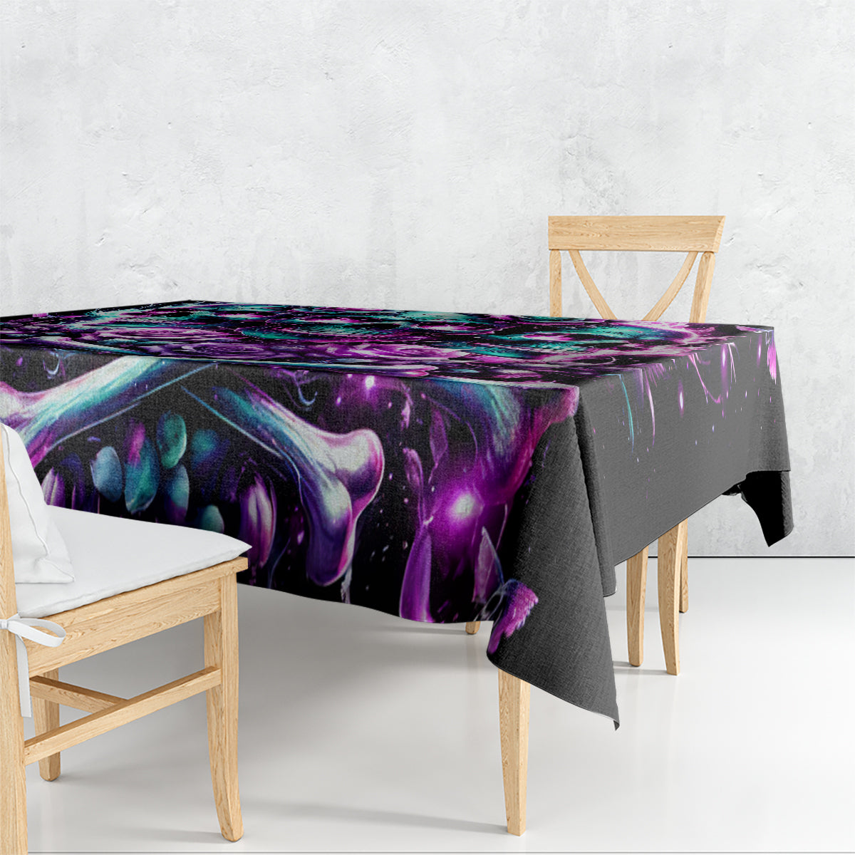 Black skull and rose tablecloth draped over table, purple and teal flame-like print