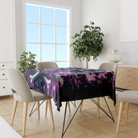 Black skull rose tablecloth covering dining table with purple and teal swirling design