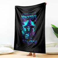 Black witch skull throw blanket with neon purple and blue graphic, held upright