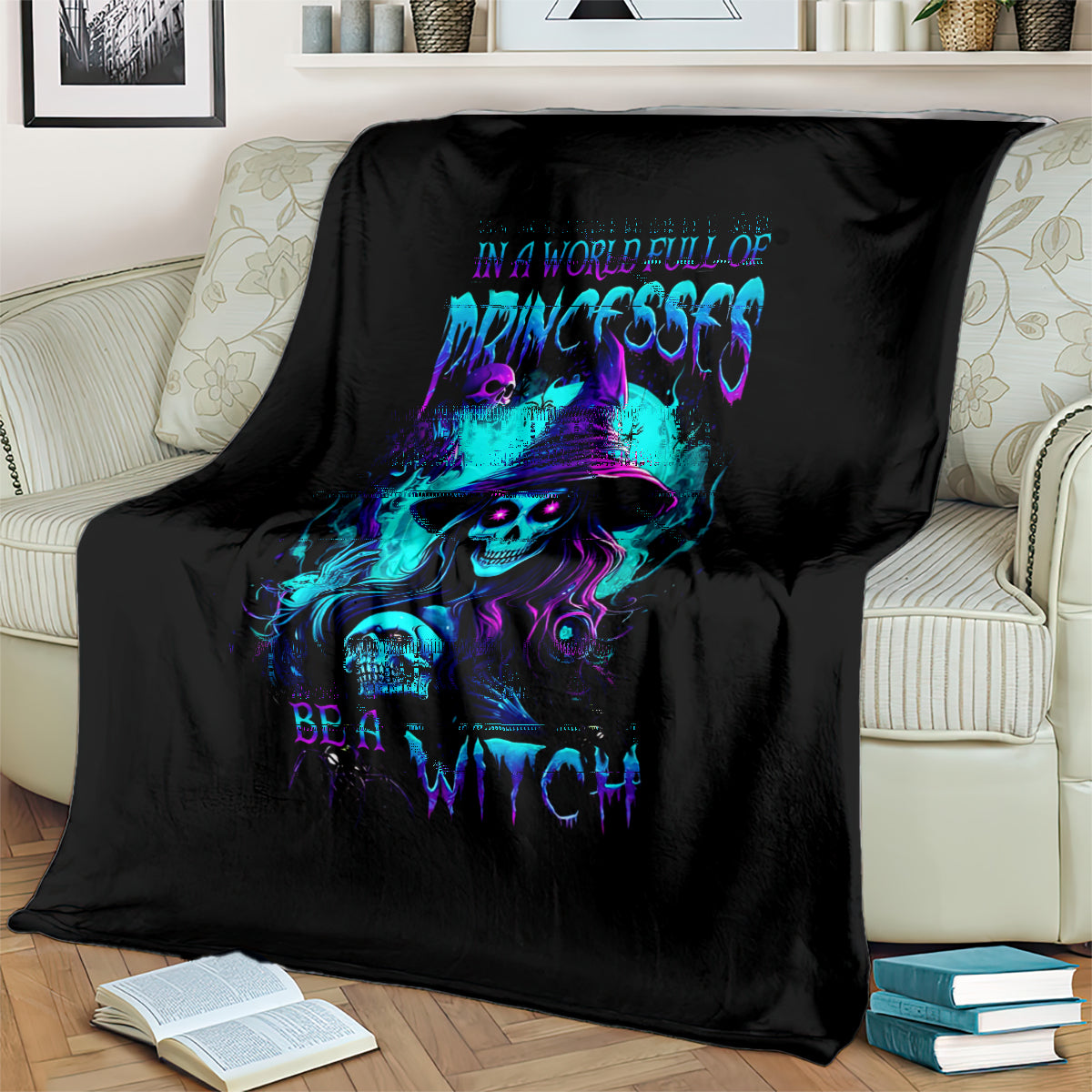 Black witch skull blanket with neon purple and blue graphic, spread on bed