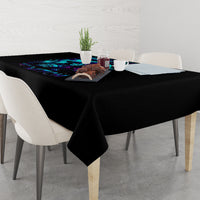 Black witch skull tablecloth with blue flame skull design, covering a dining table.