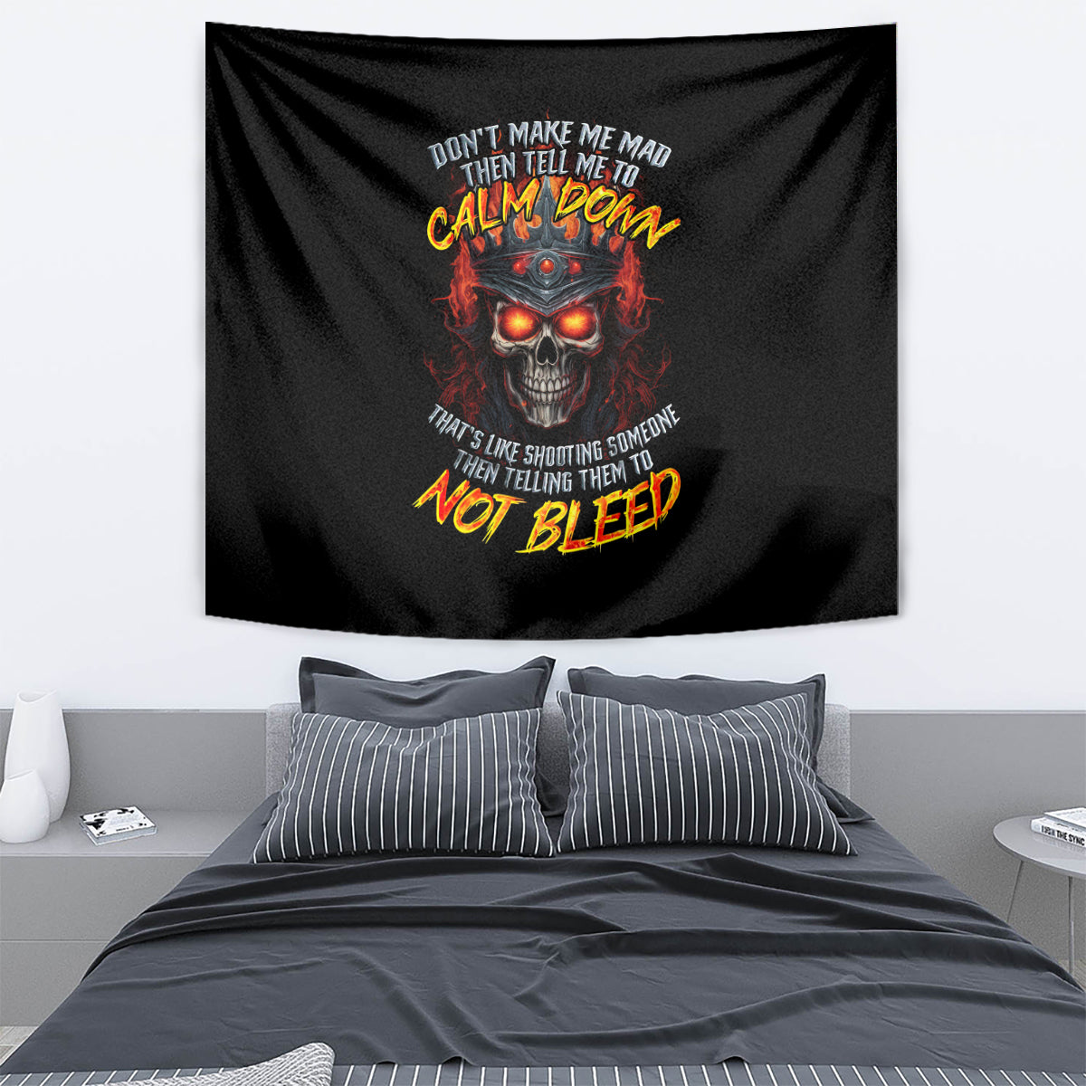 Black skull graphic tapestry with fiery glowing eyes and multicolor CALM DOWN text