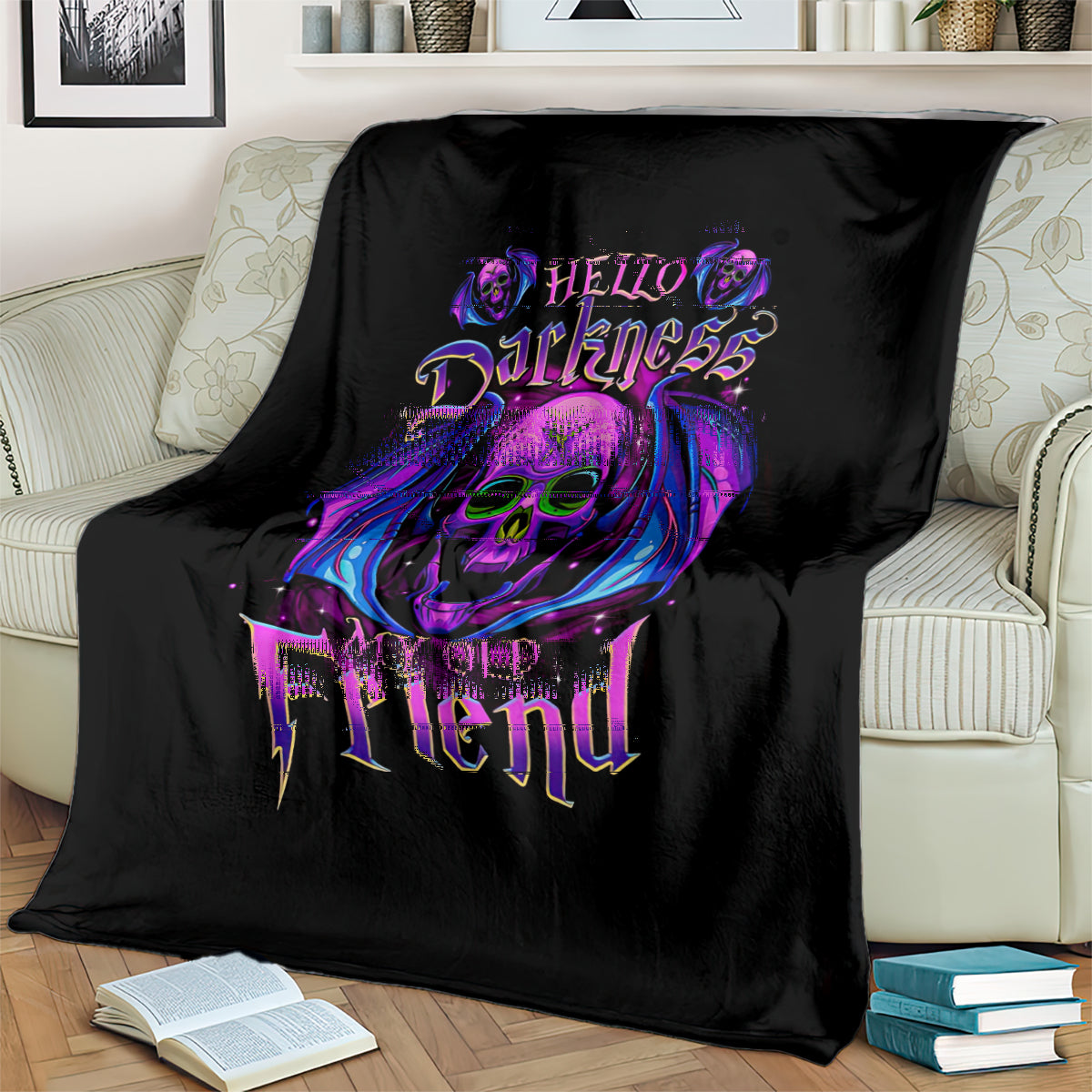 Black skull graphic blanket draped on a sofa with purple “Hello Darkness” text