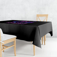 Black tablecloth with purple bat skull graphic, draped over a square table
