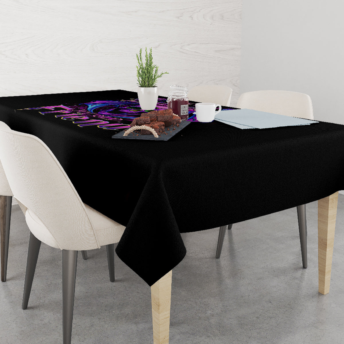 Black tablecloth over a dining table with purple bat skull border graphic