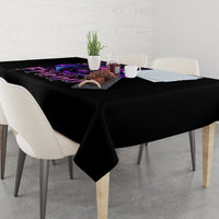 Black tablecloth over a dining table with purple bat skull border graphic
