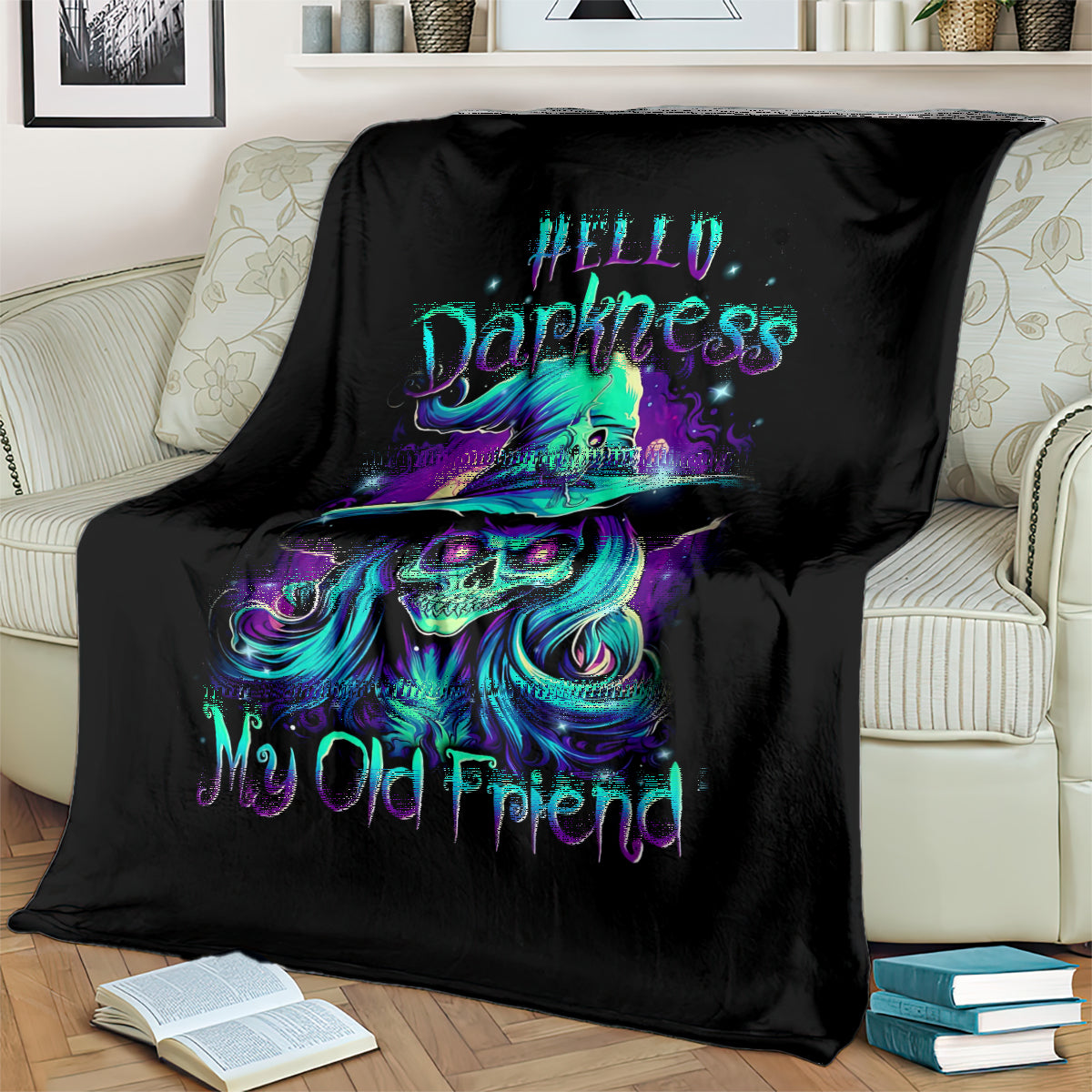 Black skull witch throw blanket on sofa with teal-purple skull witch graphic and My Old Friend