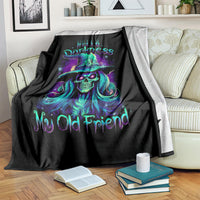Black skull witch throw blanket draped on sofa with teal and purple skull witch print