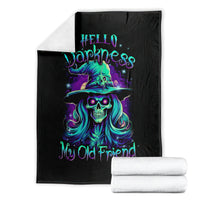 Black skull witch throw blanket folded with teal and purple neon skull witch graphic