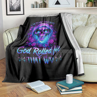 Black blanket on couch with skull and rose artwork, colorful neon text design