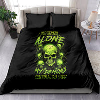 Black bedding set with neon green skull graphic on comforter and matching pillowcases