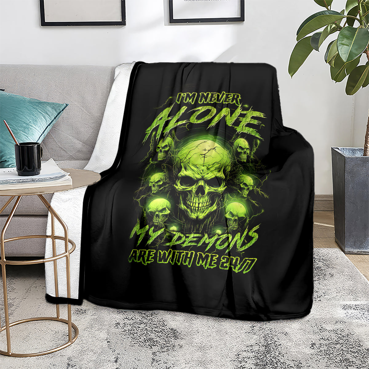 Black throw blanket with neon green skull graphic and I'M NEVER ALONE ARE WITH ME 24/7