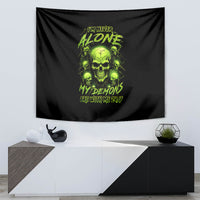 Black skull wall tapestry with neon green “I’m Never Alone” and “My Demon” text
