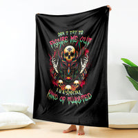 Black skull graphic blanket with hooded skull illustration and neon text