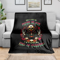 Black skull graphic blanket with colorful raised-arm design and neon text