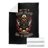 Black skull graphic blanket with centered hooded skull illustration and neon text