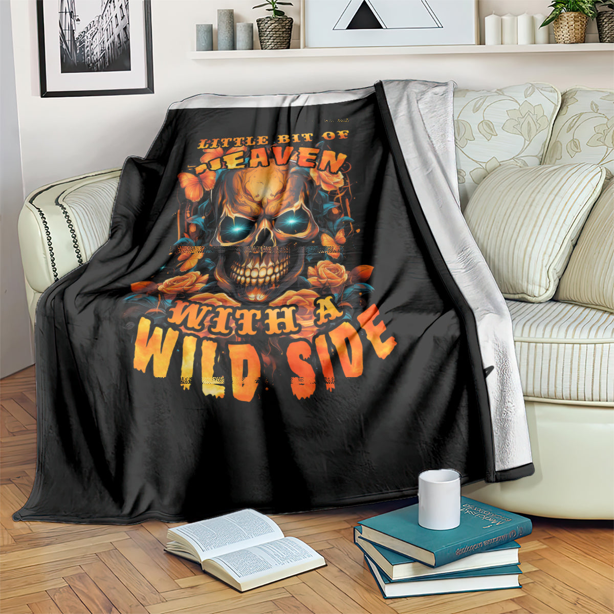 Black throw blanket with flaming skull and roses artwork, with light gray reverse