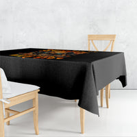 Black tablecloth with colorful skull and floral print, draped over table corner