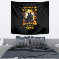 Black tapestry with colorful skull and hooded figure graphic, sunflowers, and Karma text.