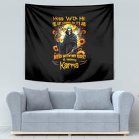 Black tapestry with colorful hooded skull figure, sunflower accents, and Karma lettering.