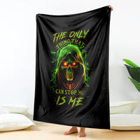 Black skull graphic throw blanket hanging vertically with green flames and warning text