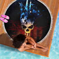 Round beach blanket, black skull design with blue stars, red stripes, white edge fringe.
