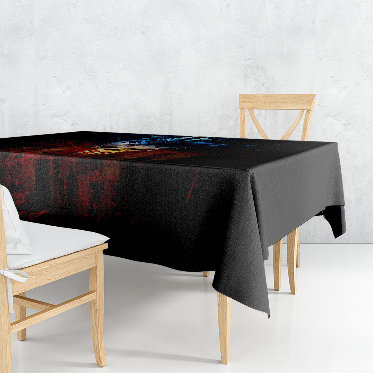 Black skull tablecloth draped over table with hanging corner