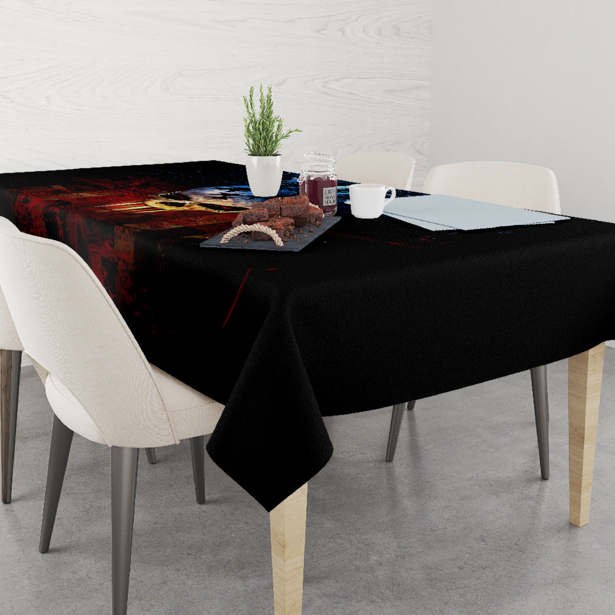 Black skull tablecloth with blue skull graphic on dining table