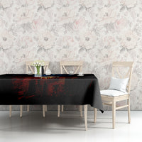 Black skull tablecloth with blue-and-red skull graphic on console table