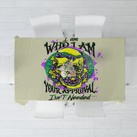 Green tablecloth with colorful skull graphic and slogan text across center