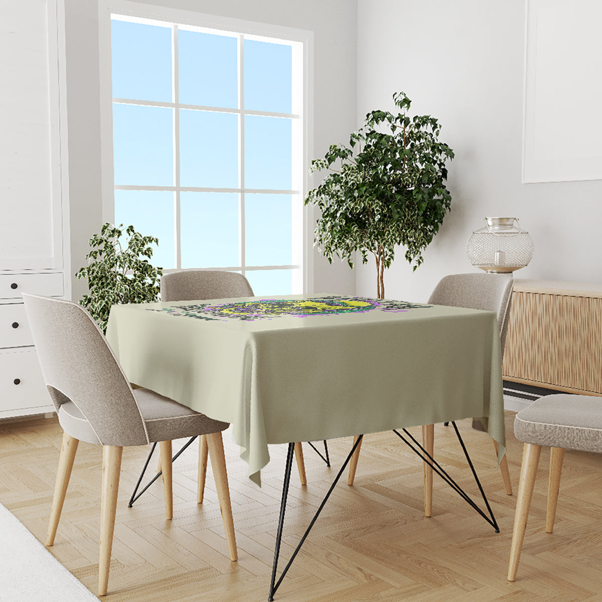 Green tablecloth with colorful skull-and-flower print centered on dining table
