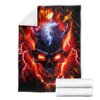 Black flame skull graphic blanket with a folded look and stacked white towels