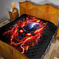 Black flame skull quilt with red lightning accents and blue glow, laid on bed