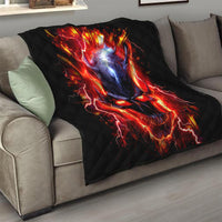 Black flame skull quilt with red lightning flames and blue glow, folded over sofa
