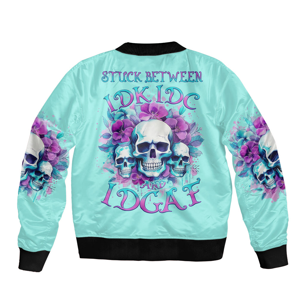 Turquoise bomber jacket with skull-and-flower graphic on the back, black ribbed trim