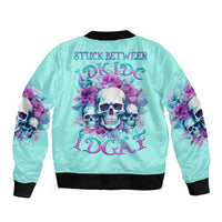 Turquoise bomber jacket with skull-and-flower graphic on the back, black ribbed trim