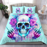 Light blue duvet and two pillows with neon skull, purple flowers, and watercolor style