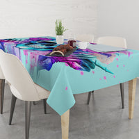 Blue tablecloth on dining table with purple skull mural and splatter accents