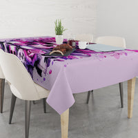 Pink skull tablecloth on dining table with purple skull and rose graphic edge