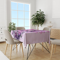 Pink skull tablecloth on dining room table with purple skull and rose splash print