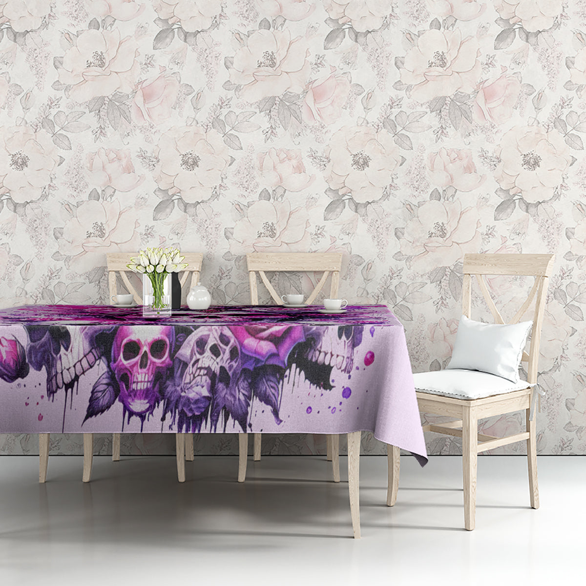 Pink skull tablecloth on table with purple skull and roses, floral background scene