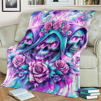 Skull angel floral throw blanket draped on sofa, purple roses and teal flames