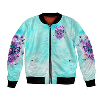 Unisex blue satin bomber jacket, front zip with black ribbed cuffs and skull artwork