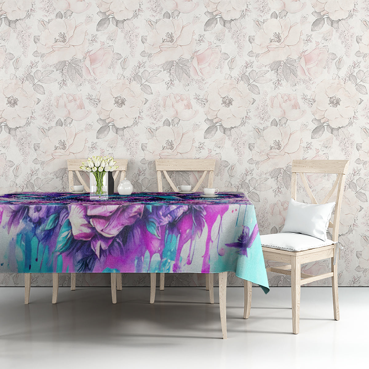 Blue-toned tablecloth with purple skull angel floral print on dining table